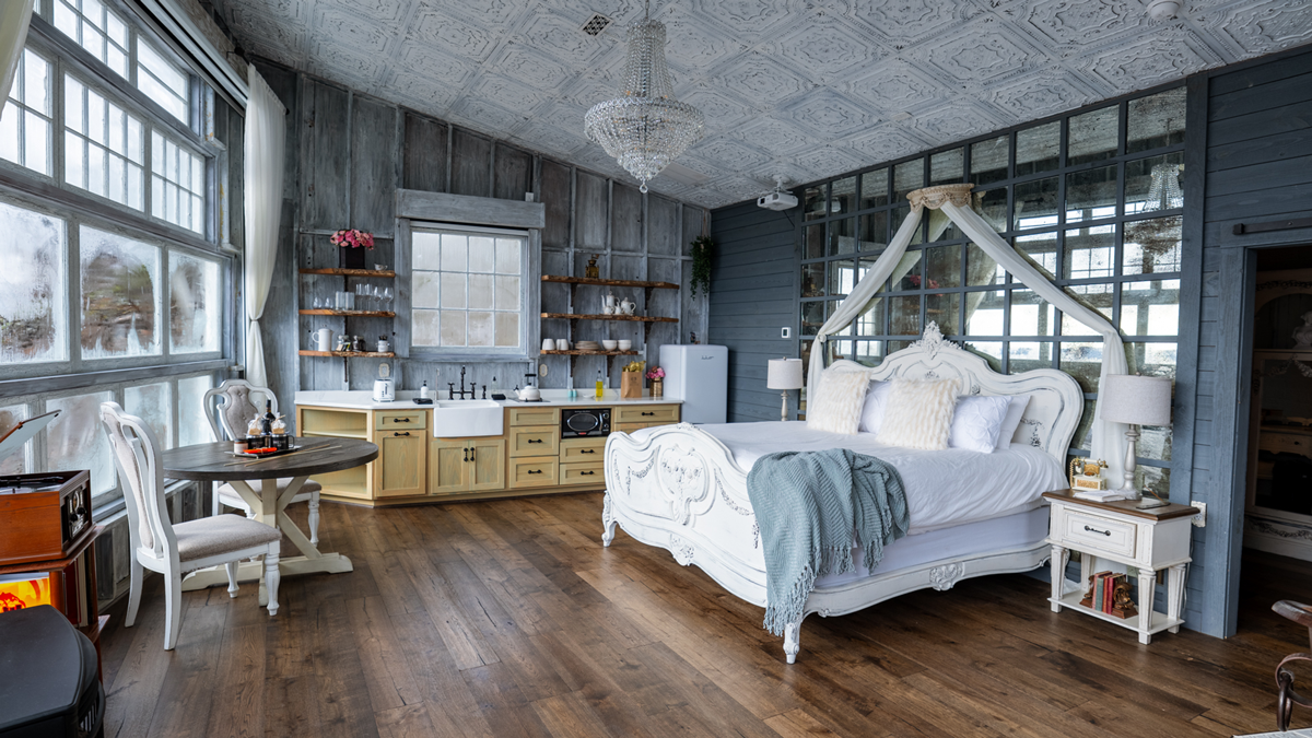 Warm, hand-finished interior of a honeymoon treehouse set up for a couple's winter stay